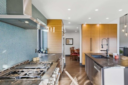 38 Sunrise Way, Priddis Greens, AB - Indoor Photo Showing Kitchen With Upgraded Kitchen