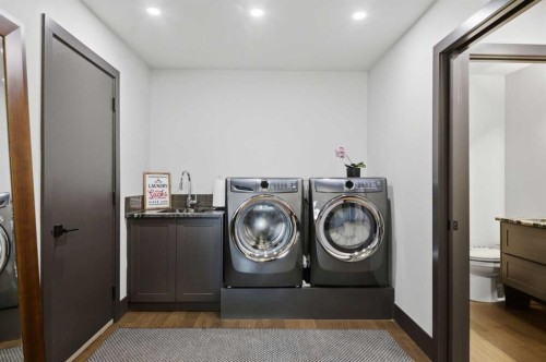 38 Sunrise Way, Priddis Greens, AB - Indoor Photo Showing Laundry Room