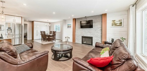 56 Patterson Crescent Sw, Calgary, AB - Indoor Photo Showing Living Room With Fireplace