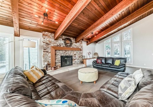 56 Patterson Crescent Sw, Calgary, AB - Indoor Photo Showing Living Room With Fireplace