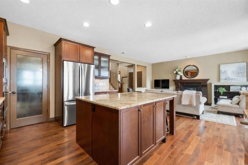 140 Mahogany Terrace Se, Calgary, AB - Indoor Photo Showing Kitchen With Fireplace