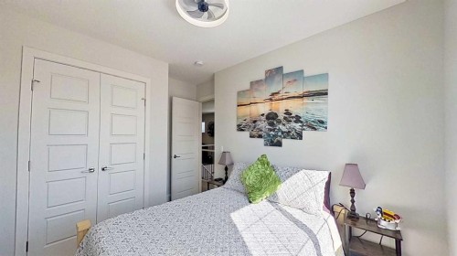 163 Sundown Crescent, Cochrane, AB - Indoor Photo Showing Bedroom