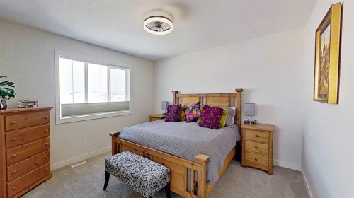 163 Sundown Crescent, Cochrane, AB - Indoor Photo Showing Bedroom