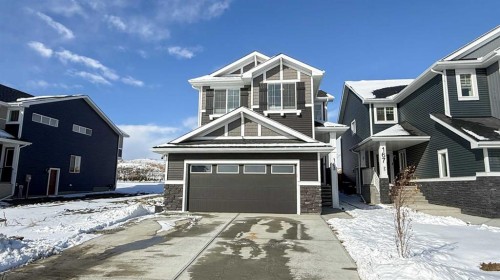 163 Sundown Crescent, Cochrane, AB - Outdoor With Facade