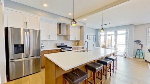 163 Sundown Crescent, Cochrane, AB - Indoor Photo Showing Kitchen With Double Sink With Upgraded Kitchen