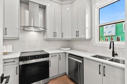 102 South Shore Road, Chestermere, AB - Indoor Photo Showing Kitchen With Double Sink With Upgraded Kitchen