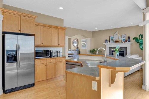 97 Strathridge Close Sw, Calgary, AB - Indoor Photo Showing Kitchen With Double Sink