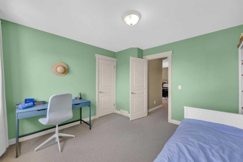 97 Strathridge Close Sw, Calgary, AB - Indoor Photo Showing Bedroom