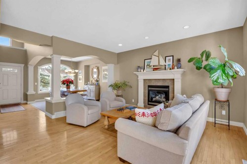 97 Strathridge Close Sw, Calgary, AB - Indoor Photo Showing Living Room With Fireplace