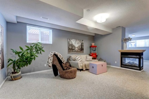 27 Elgin Drive Se, Calgary, AB - Indoor With Fireplace
