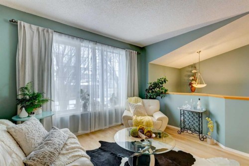 27 Elgin Drive Se, Calgary, AB - Indoor Photo Showing Living Room