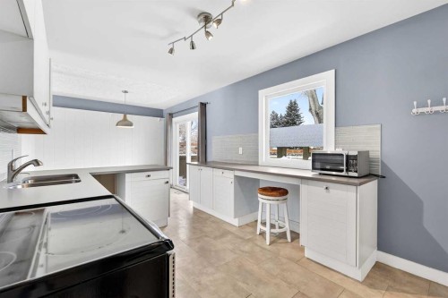79 Hillary Crescent Sw, Calgary, AB - Indoor Photo Showing Kitchen With Double Sink
