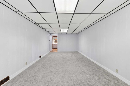 79 Hillary Crescent Sw, Calgary, AB - Indoor Photo Showing Other Room
