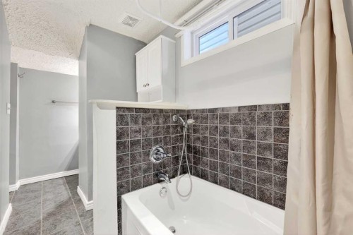 79 Hillary Crescent Sw, Calgary, AB - Indoor Photo Showing Bathroom