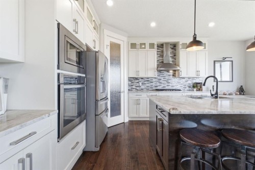 1469 Aldrich Place, Carstairs, AB - Indoor Photo Showing Kitchen With Upgraded Kitchen