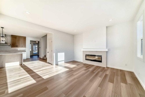 67 Creekside Path Sw, Calgary, AB - Indoor Photo Showing Living Room With Fireplace