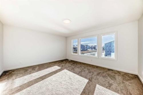 67 Creekside Path Sw, Calgary, AB - Indoor Photo Showing Other Room