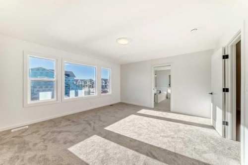 67 Creekside Path Sw, Calgary, AB - Indoor Photo Showing Other Room