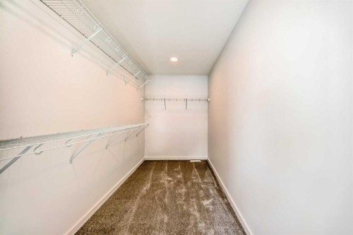 67 Creekside Path Sw, Calgary, AB - Indoor Photo Showing Other Room