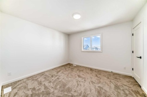 67 Creekside Path Sw, Calgary, AB - Indoor Photo Showing Other Room