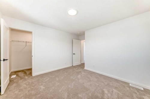 67 Creekside Path Sw, Calgary, AB - Indoor Photo Showing Other Room