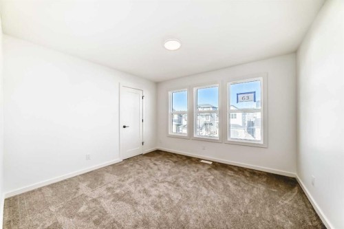 67 Creekside Path Sw, Calgary, AB - Indoor Photo Showing Other Room