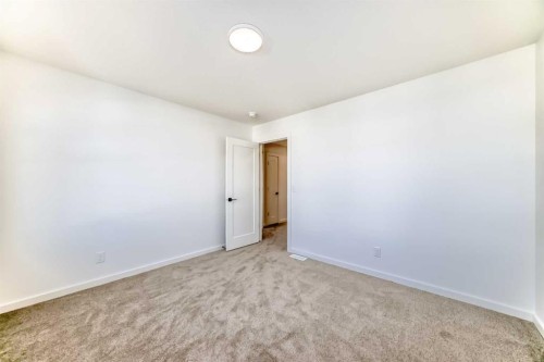 67 Creekside Path Sw, Calgary, AB - Indoor Photo Showing Other Room
