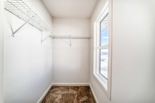 67 Creekside Path Sw, Calgary, AB - Indoor Photo Showing Other Room