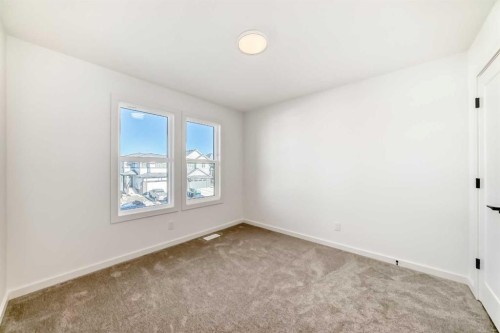 67 Creekside Path Sw, Calgary, AB - Indoor Photo Showing Other Room