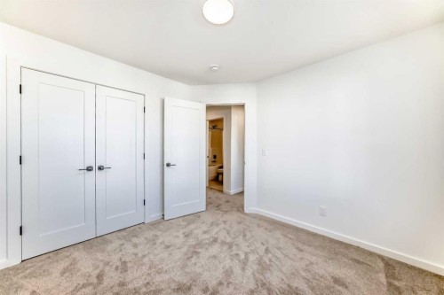 67 Creekside Path Sw, Calgary, AB - Indoor Photo Showing Other Room