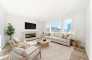 67 Creekside Path Sw, Calgary, AB  - Indoor Photo Showing Living Room With Fireplace 