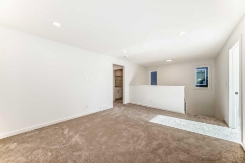 67 Creekside Path Sw, Calgary, AB - Indoor Photo Showing Other Room