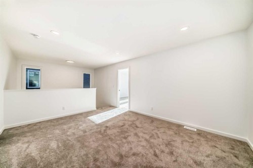 67 Creekside Path Sw, Calgary, AB - Indoor Photo Showing Other Room