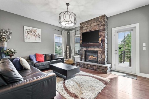22 Wendham Place Sw, Calgary, AB - Indoor Photo Showing Living Room With Fireplace