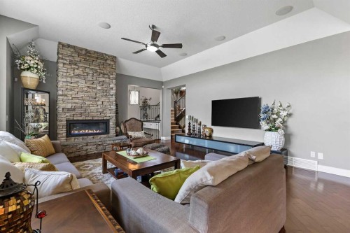 22 Wendham Place Sw, Calgary, AB - Indoor Photo Showing Living Room With Fireplace