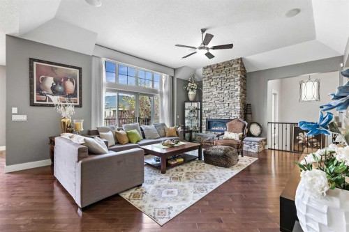 22 Wendham Place Sw, Calgary, AB - Indoor Photo Showing Living Room With Fireplace