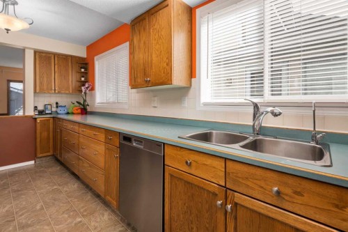 232 Millbank Drive Sw, Calgary, AB - Indoor Photo Showing Kitchen With Double Sink