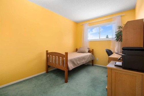 232 Millbank Drive Sw, Calgary, AB - Indoor Photo Showing Bedroom