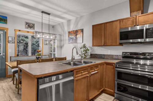 4-36 Windridge Road, Exshaw, AB - Indoor Photo Showing Kitchen With Double Sink