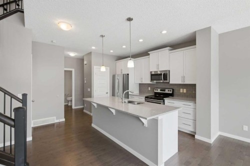 54 Legacy Close Se, Calgary, AB - Indoor Photo Showing Kitchen With Double Sink With Upgraded Kitchen