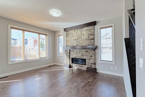 107 Nolancrest Rise Nw, Calgary, AB - Indoor Photo Showing Living Room With Fireplace
