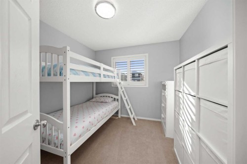 47 Eversyde Heath Sw, Calgary, AB - Indoor Photo Showing Bedroom