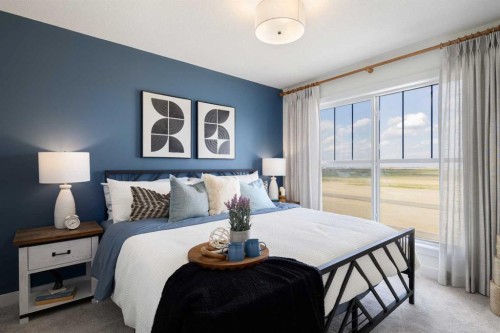 145 Wild Rose Way Se, Calgary, AB - Indoor Photo Showing Bedroom
