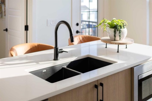 145 Wild Rose Way Se, Calgary, AB - Indoor Photo Showing Kitchen With Double Sink