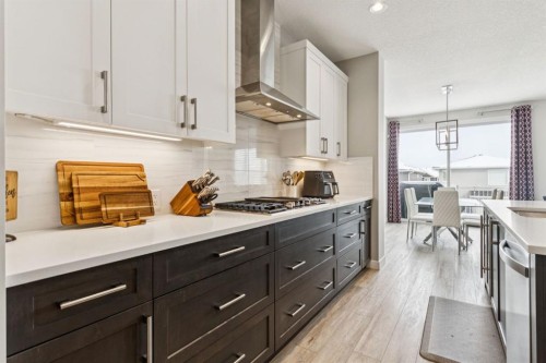 415 Rivercrest Boulevard, Cochrane, AB - Indoor Photo Showing Kitchen With Upgraded Kitchen