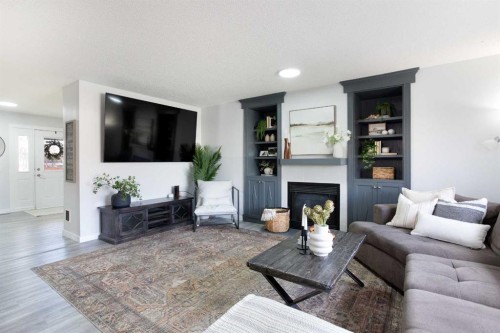 8 Thorndale Close Se, Airdrie, AB - Indoor Photo Showing Living Room With Fireplace