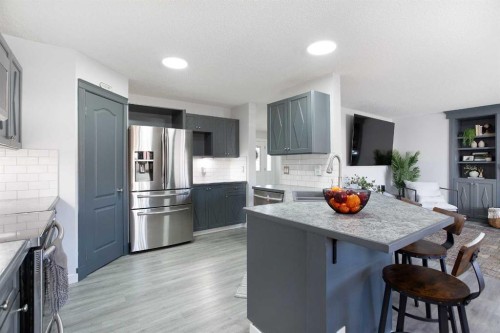 8 Thorndale Close Se, Airdrie, AB - Indoor Photo Showing Kitchen With Upgraded Kitchen