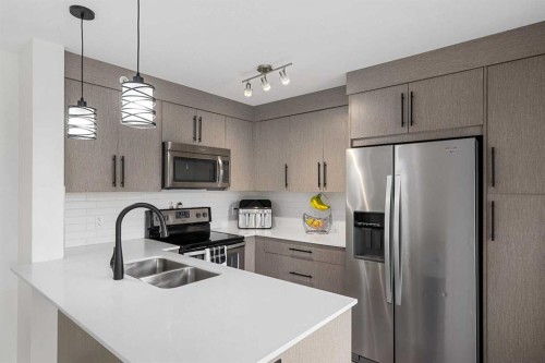 2408-302 Skyview Ranch Drive Ne, Calgary, AB - Indoor Photo Showing Kitchen With Stainless Steel Kitchen With Double Sink With Upgraded Kitchen