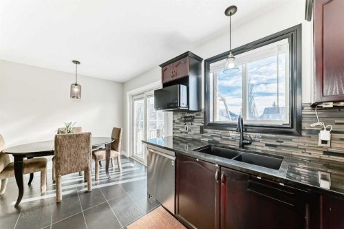 80 Hidden Point Nw, Calgary, AB - Indoor Photo Showing Kitchen With Double Sink With Upgraded Kitchen