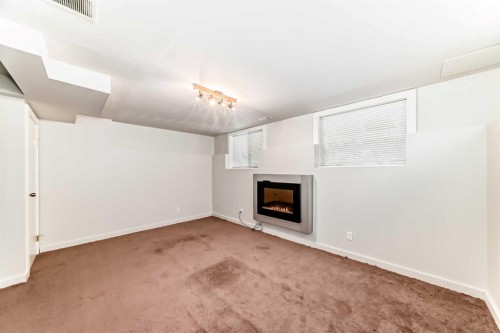 80 Hidden Point Nw, Calgary, AB - Indoor With Fireplace
